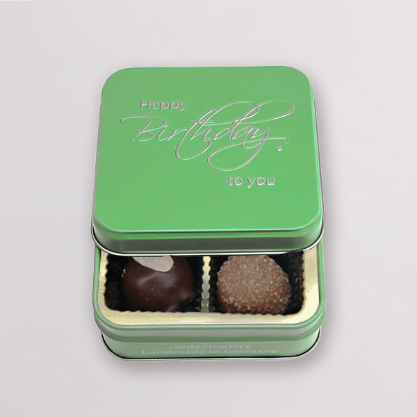 This exquisite selection of handmade chocolates in a reusable metal box with 3D embossing. It bears the inscription "Happy Birthday“.

Contents: 50 g