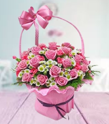 Youthful - Flowers Artistically Arranged in Lovely Pink Basket 