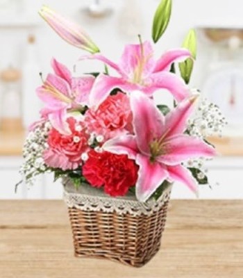 Perfumed Stargazer Lilies in Traditional Raffia Basket