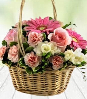 Freesia Gerbera Daisies Roses and Carnations In Willow Basket