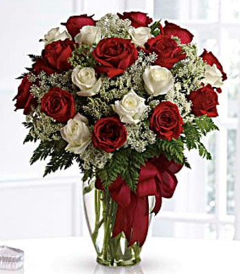 Expertly Crafted Red, Cerise and Cream Roses in Vase