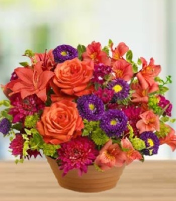 Orange Roses with Bright Seasonal Flowers
