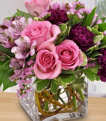 Spring Symphony - Roses, Alstroemeria & Carnations in Curve Vase