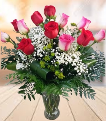 Red and Pink Roses in Vase with Baby's Breath and Green