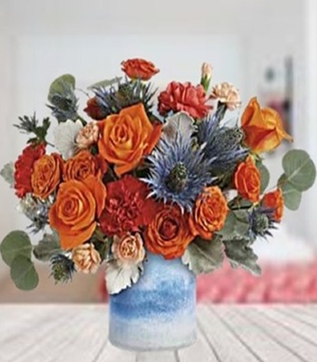Orange Roses And Carnations With Blue Eryngium