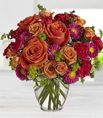 Orange Roses With Matsumoto Asters And Carnations