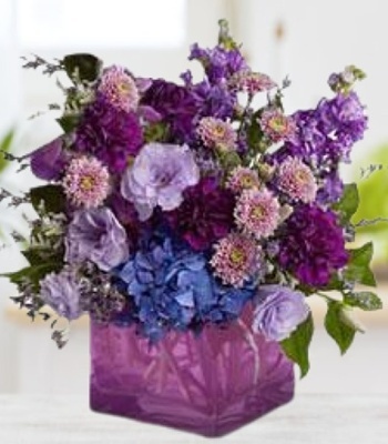 Purple Flowers in Glass Vase