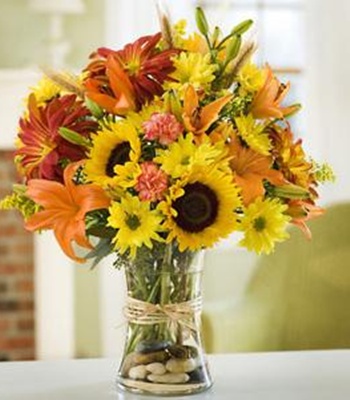 Mixed Seasonal Flowers Arrangement in a Glass Vase