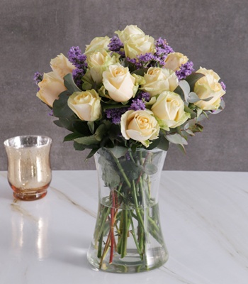 Cream Roses In Clear Vase