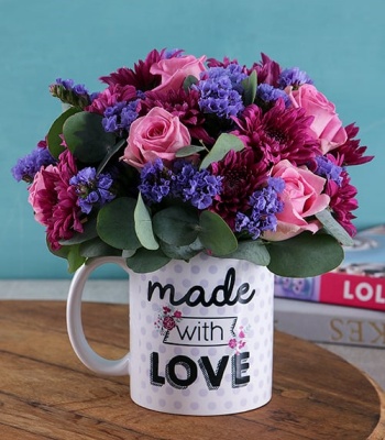 Purple Floral Arrangement In Mug