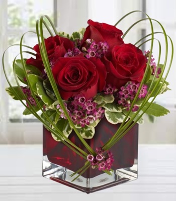 Roses with Heart of Bear Grass and Ruby-Red Glass Vase